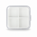 Clear square pill container with four compartments