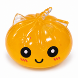 Orange translucent unicorn dumpling squishy with smiling face