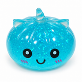 Blue translucent unicorn dumpling squishy with smiling face
