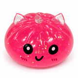 Pink translucent glitter unicorn dumpling squishy with smiling face