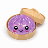 Purple glitter dumpling squishy in a tan steamer-style container with lid