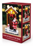 Light-Up Santa at the Door Decoration – 14 cm